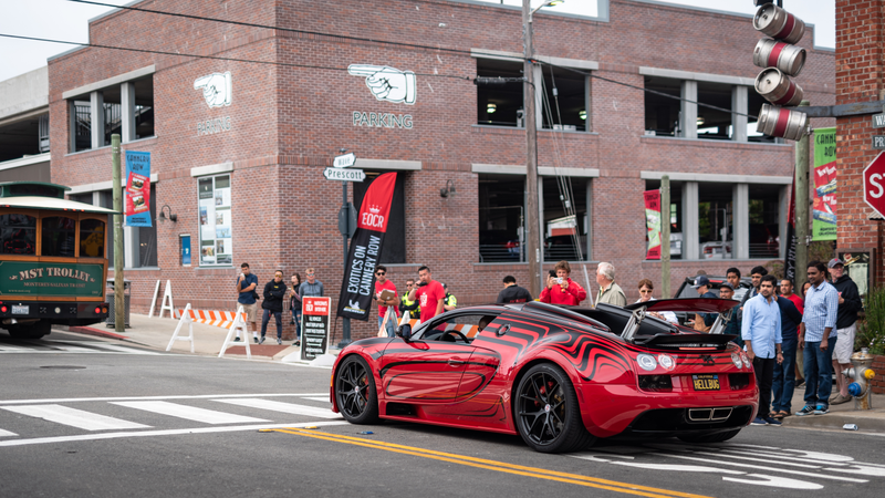 A crowd and a Bugatti